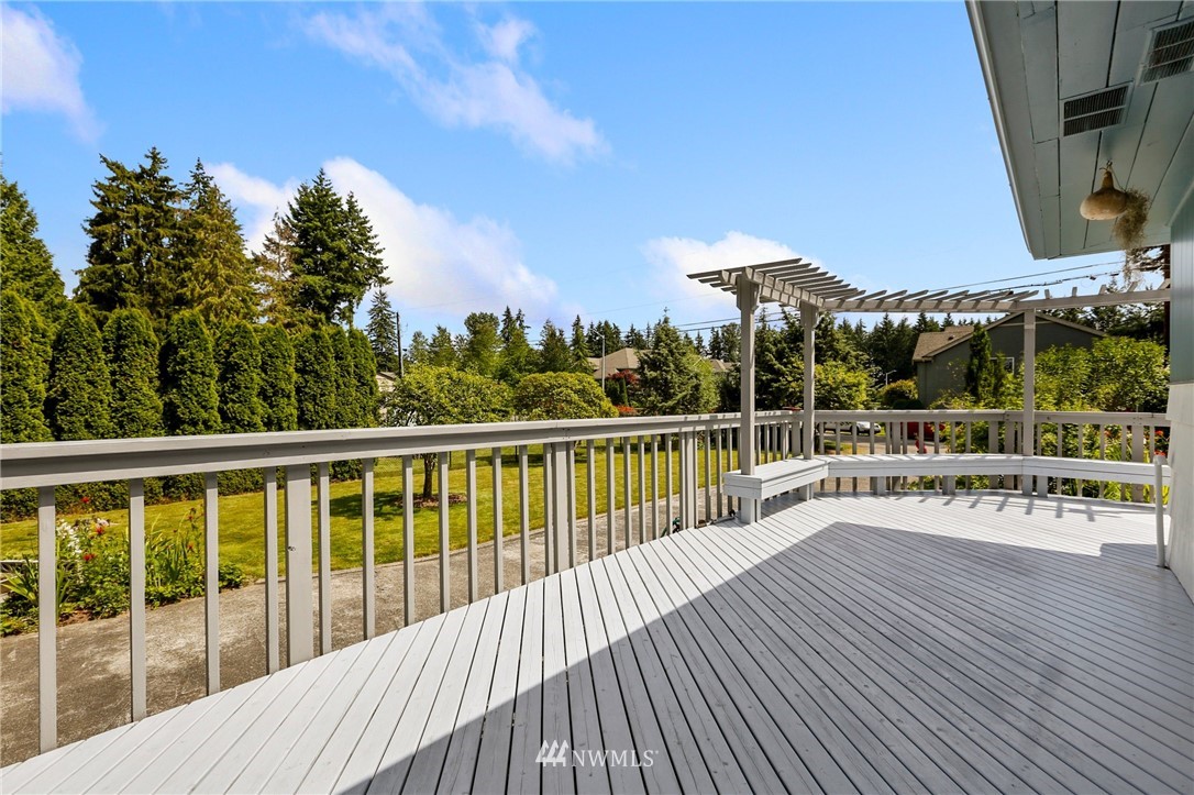 717 224th Street Southwest Bothell, WA 98021 - Photo 34 of 40 a view of a balcony with wooden floor and fence