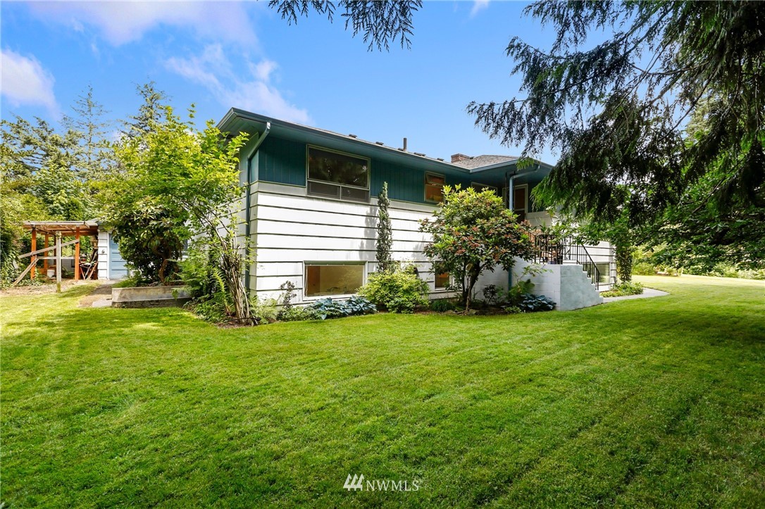 717 224th Street Southwest Bothell, WA 98021 - Photo 35 of 40 a front view of a house with a garden