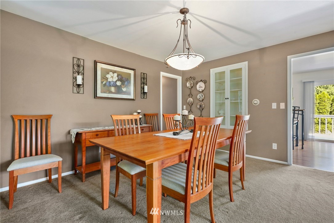 717 224th Street Southwest Bothell, WA 98021 - Photo 9 of 40 a view of a dining room with furniture window and wooden floor