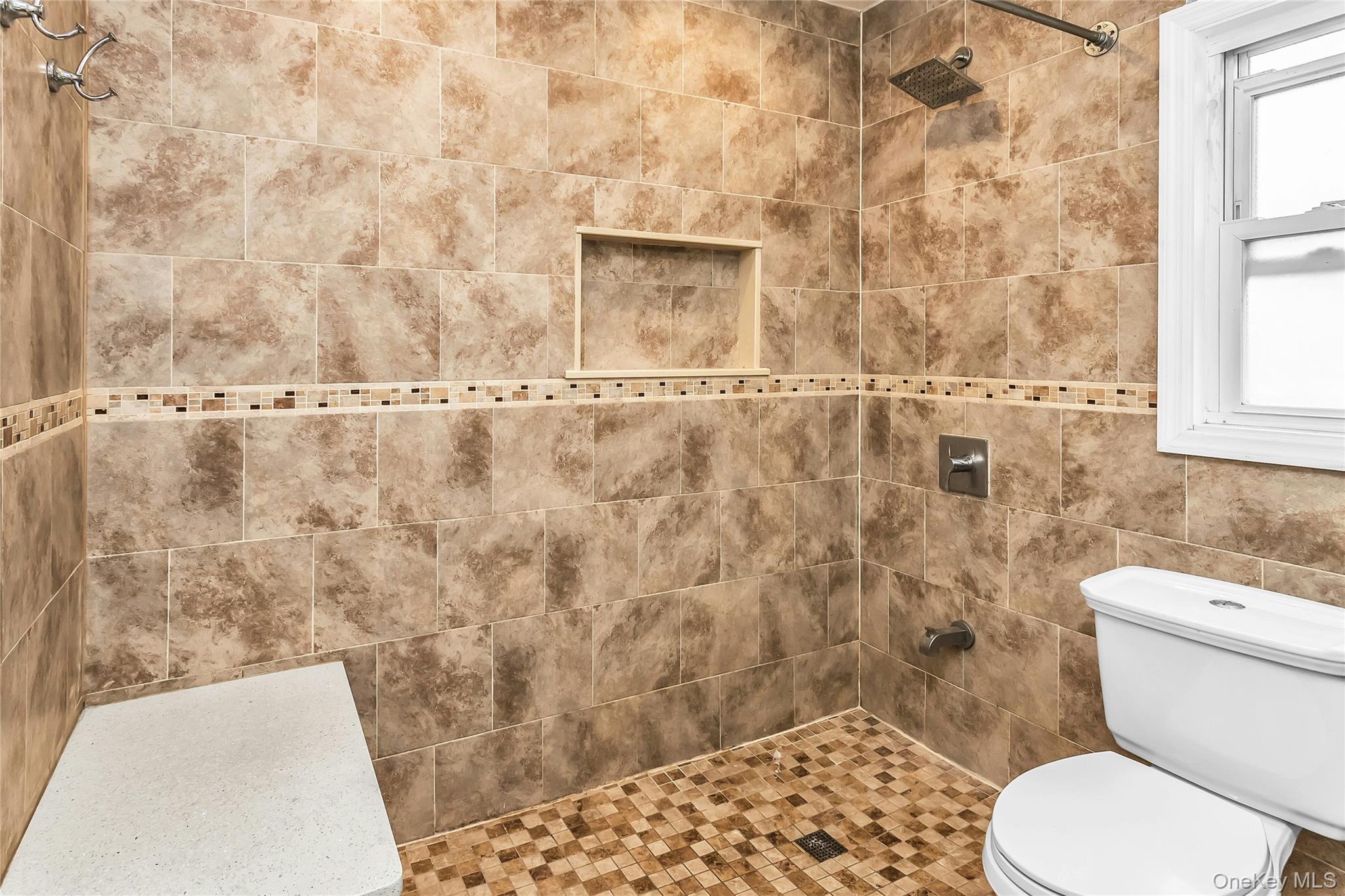 103 Union Street Valley Stream, NY 11580 - Photo 7 of 19 a bathroom with a toilet and a shower
