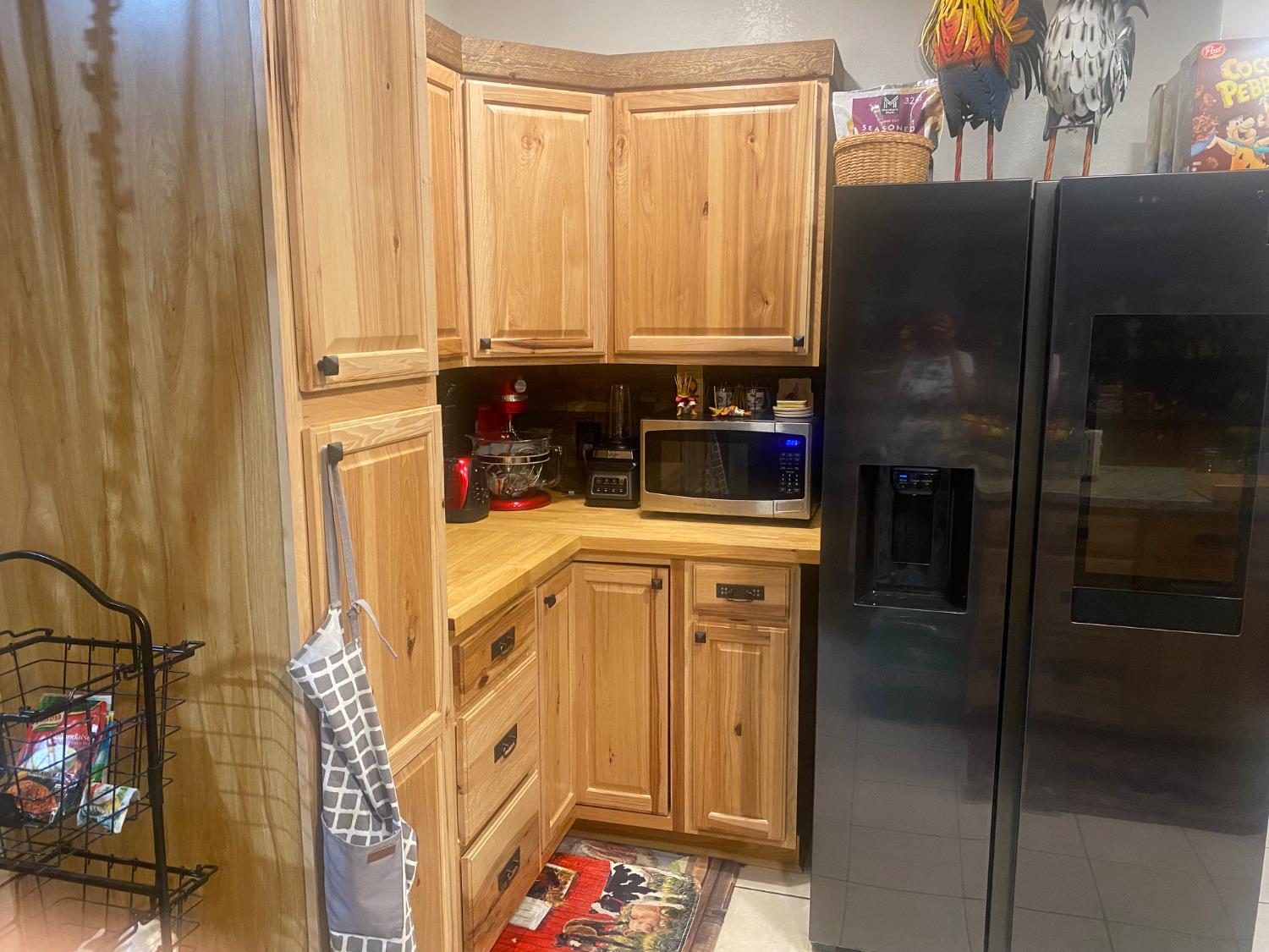 2575 South Willow, Unit 25 Fresno, CA 93725 - Photo 9 of 31 a kitchen with a refrigerator and cabinets