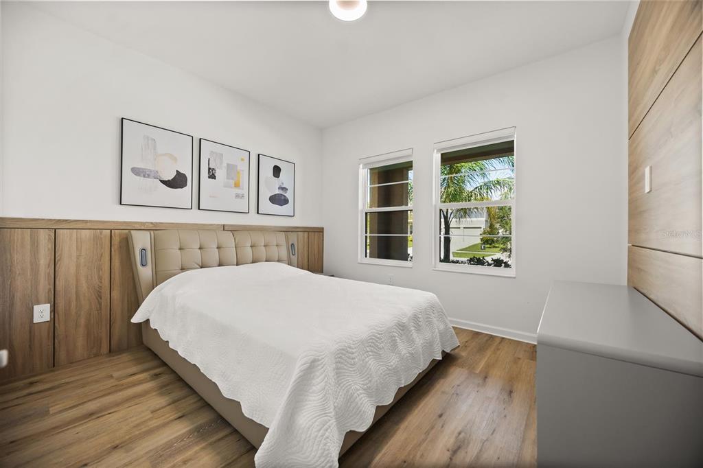 11163 Great Rock Street Winter Garden, FL 34787 - Photo 13 of 36 a bedroom with a bed and a window