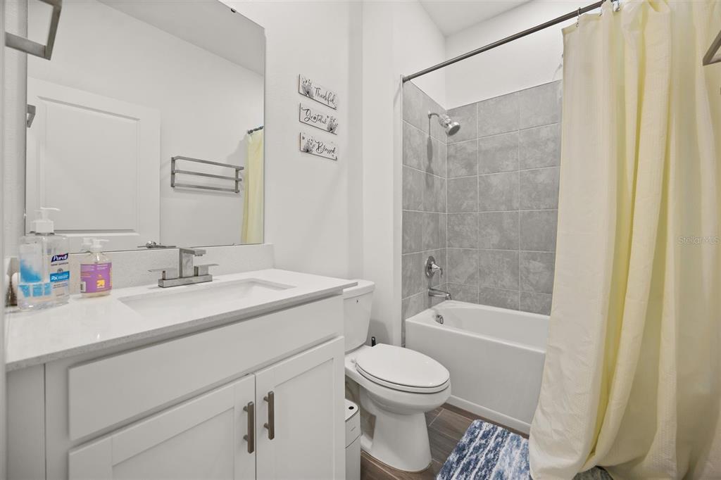 11163 Great Rock Street Winter Garden, FL 34787 - Photo 14 of 36 a bathroom with a sink a toilet and shower
