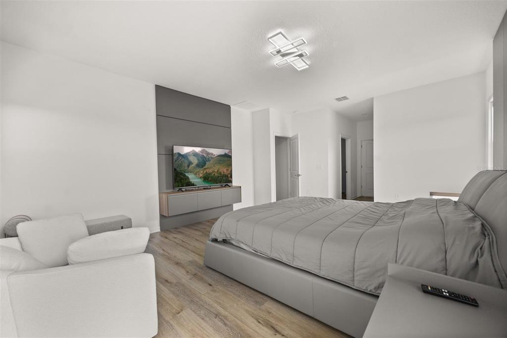 11163 Great Rock Street Winter Garden, FL 34787 - Photo 20 of 36 a living room with a bed furniture and a window