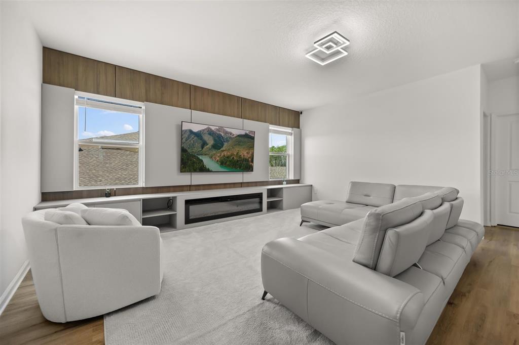 11163 Great Rock Street Winter Garden, FL 34787 - Photo 25 of 36 a living room with furniture and a flat screen tv