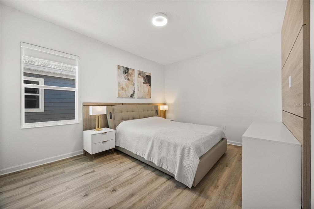 11163 Great Rock Street Winter Garden, FL 34787 - Photo 27 of 36 a bedroom with a bed and window