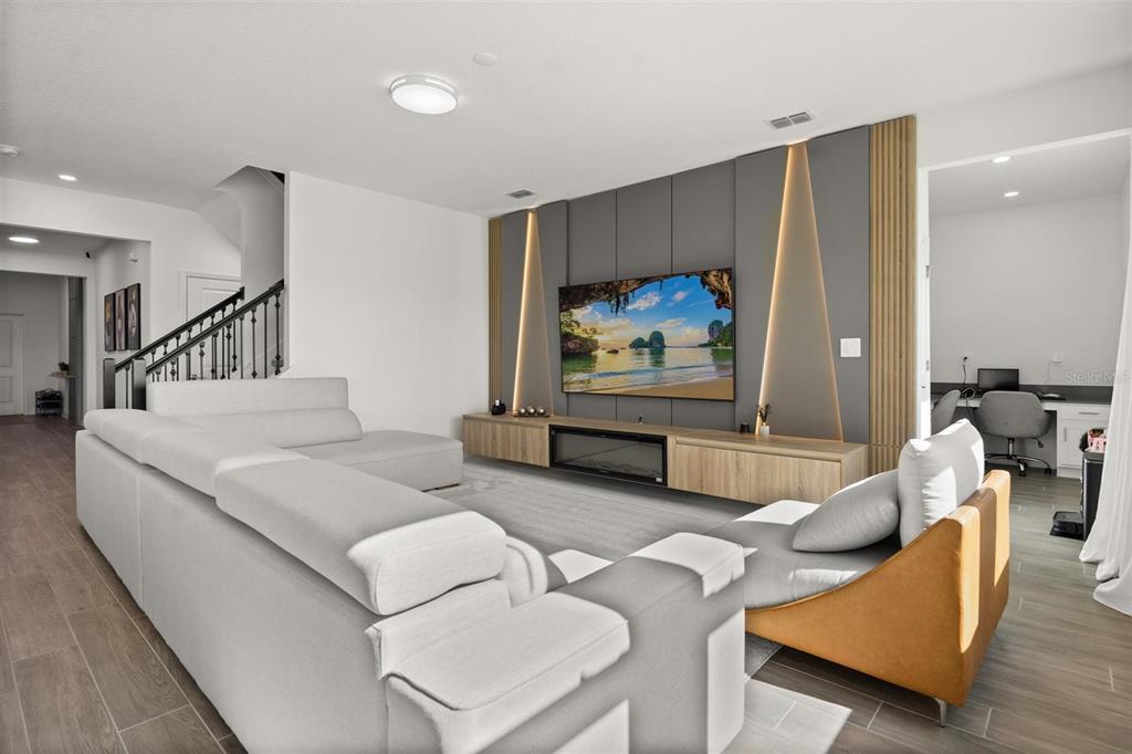 11163 Great Rock Street Winter Garden, FL 34787 - Photo 5 of 36 a living room with furniture and a flat screen tv