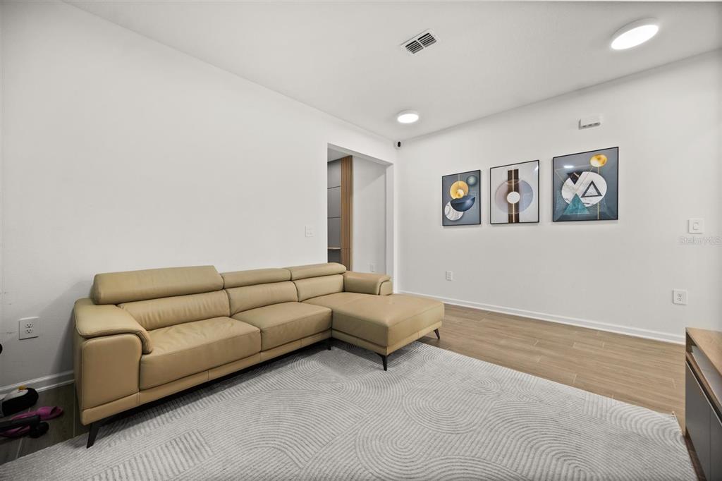 11163 Great Rock Street Winter Garden, FL 34787 - Photo 7 of 36 a living room with furniture and a couch