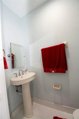 a white toilet sitting next to a shower