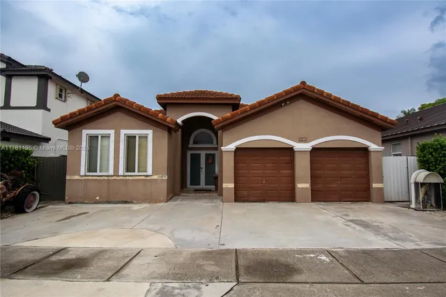 a front view of a house with a garage