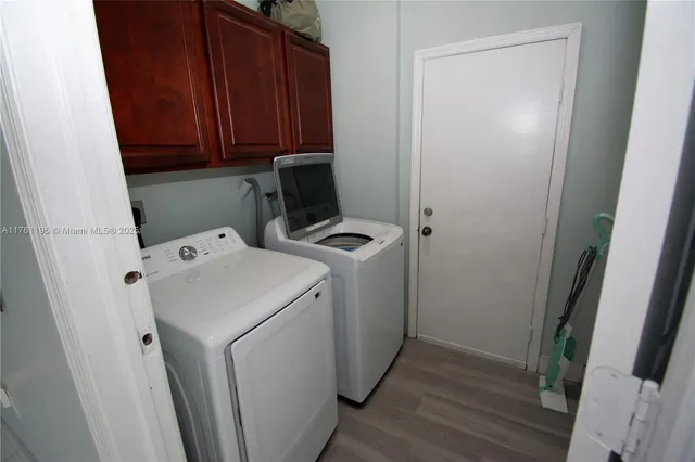 a view of a kitchen with a sink and cabinet area