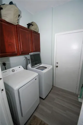 a view of a kitchen with a sink and a stove top oven