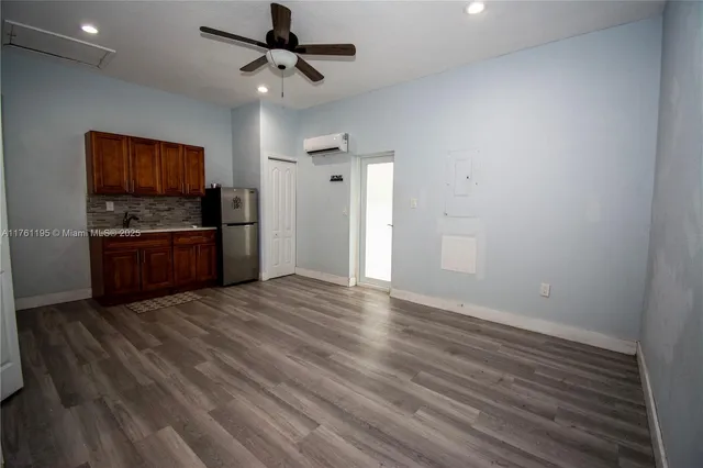 a bathroom with a toilet sink and shower
