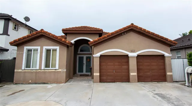 a front view of a house with a garage