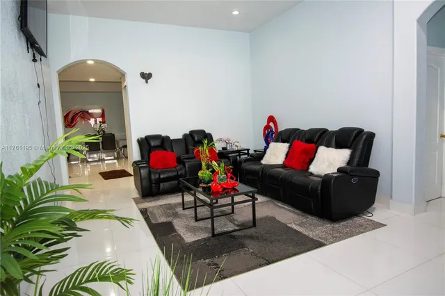 a living room with furniture and a couch