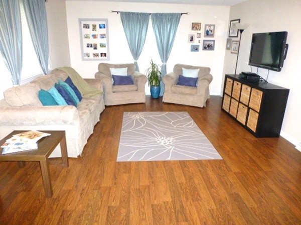 59 Mountain Gate Road, Unit 59 Ashland, MA 01721 - Photo 1 of 25 a living room with furniture and a flat screen tv