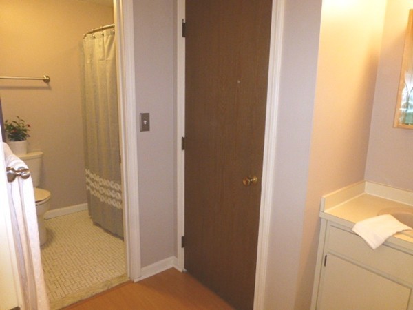 59 Mountain Gate Road, Unit 59 Ashland, MA 01721 - Photo 13 of 25 a bathroom with a granite countertop sink a toilet and shower