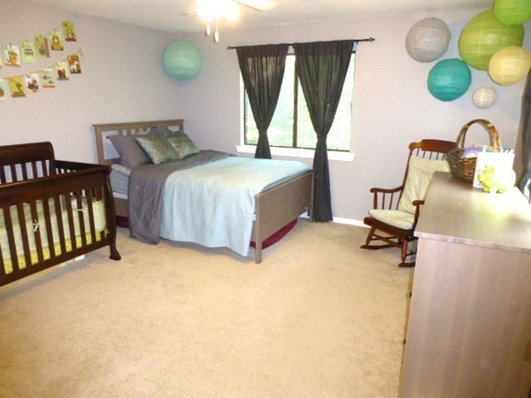 59 Mountain Gate Road, Unit 59 Ashland, MA 01721 - Photo 16 of 25 a bedroom with a bed dresser and a window