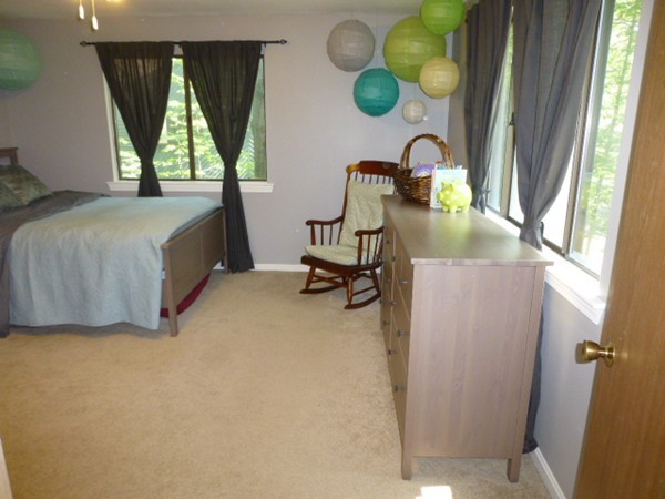 59 Mountain Gate Road, Unit 59 Ashland, MA 01721 - Photo 18 of 25 a bedroom with bed and window