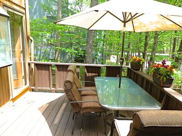 59 Mountain Gate Road, Unit 59 Ashland, MA 01721 - Photo 23 of 25 a view of a chairs and table in the balcony