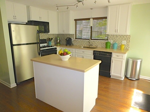 59 Mountain Gate Road, Unit 59 Ashland, MA 01721 - Photo 5 of 25 a kitchen with a refrigerator a stove a sink dishwasher and a refrigerator with wooden floor