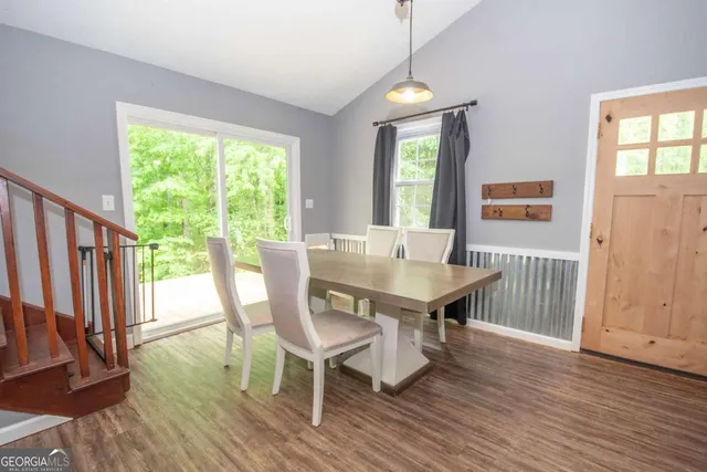 a view of a dining room with furniture window and wooden floor