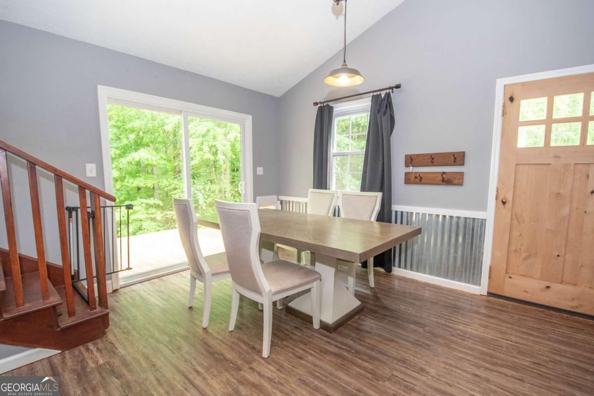 3414 Rock Mills Road LaGrange, GA 30240 - Photo 11 of 54 a view of a dining room with furniture window and wooden floor