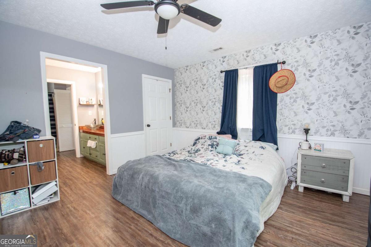 3414 Rock Mills Road LaGrange, GA 30240 - Photo 19 of 54 a spacious bedroom with a bed and a dresser