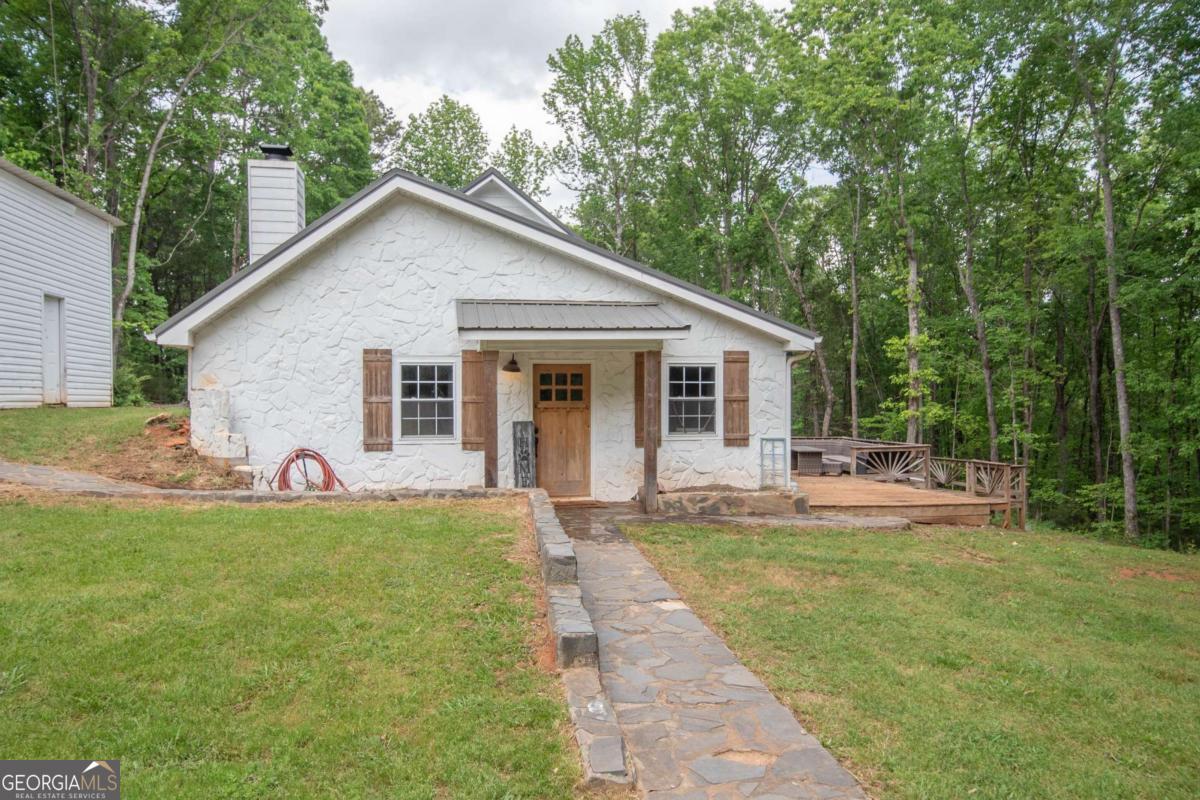 3414 Rock Mills Road LaGrange, GA 30240 - Photo 2 of 54 a view of a house with a yard and sitting area