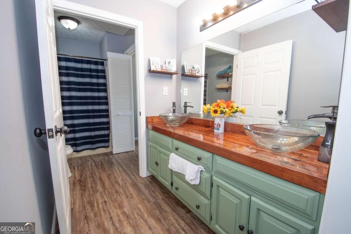 3414 Rock Mills Road LaGrange, GA 30240 - Photo 21 of 54 a bathroom with a sink and a mirror