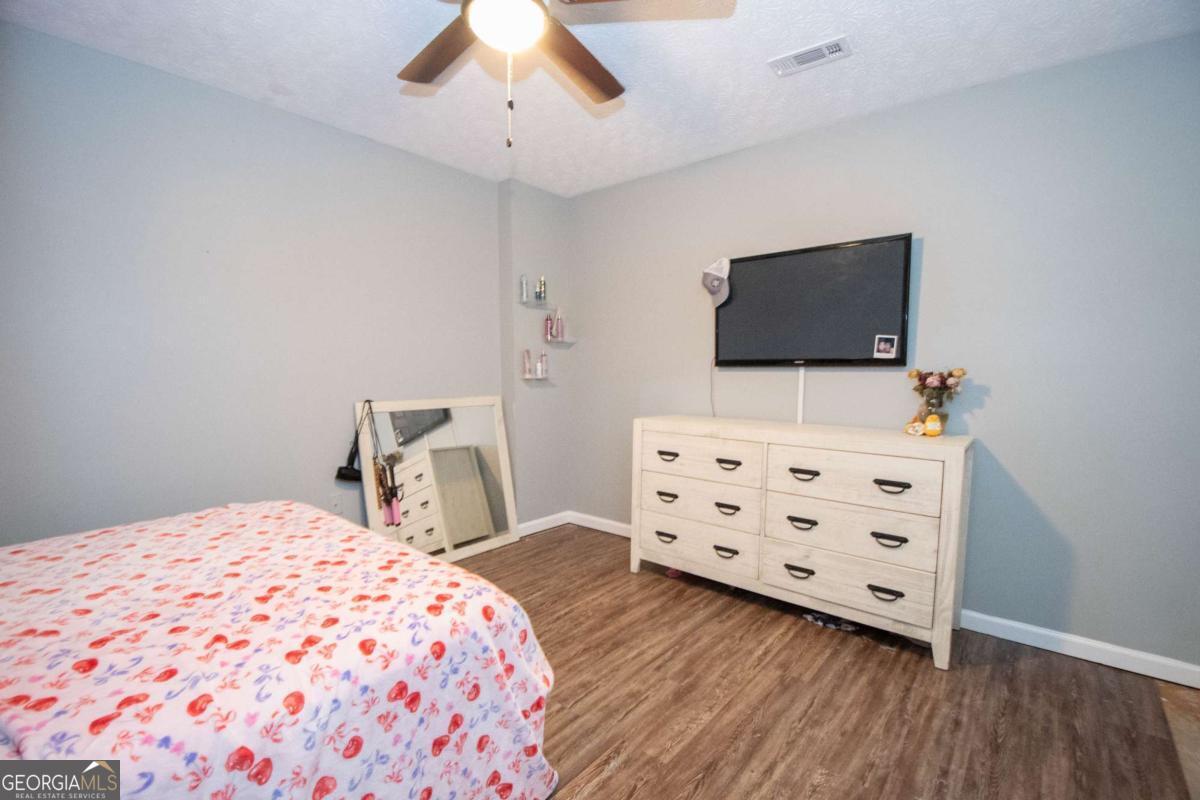 3414 Rock Mills Road LaGrange, GA 30240 - Photo 24 of 54 a bedroom with a bed and flat screen tv
