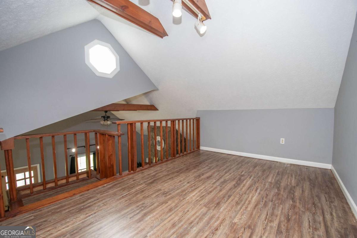 3414 Rock Mills Road LaGrange, GA 30240 - Photo 27 of 54 a view of a hallway with wooden floor