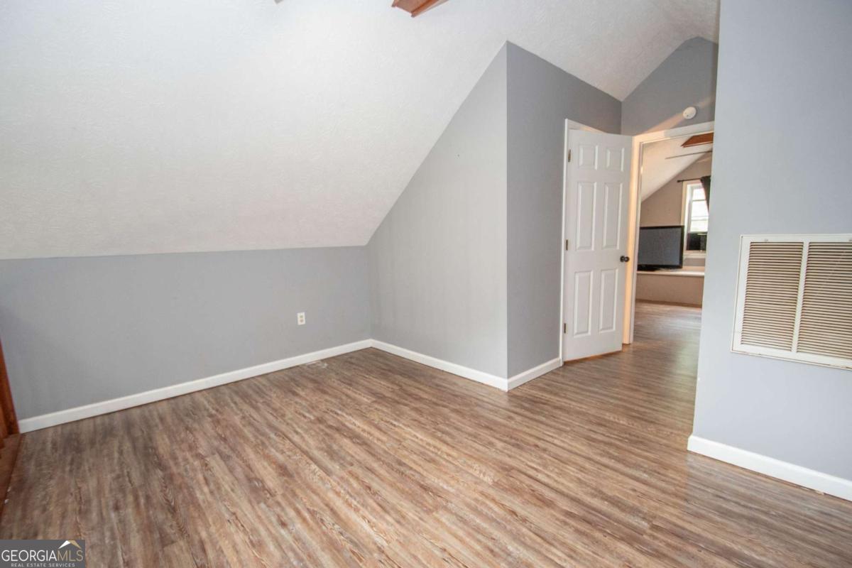 3414 Rock Mills Road LaGrange, GA 30240 - Photo 28 of 54 a view of a hallway with wooden floor