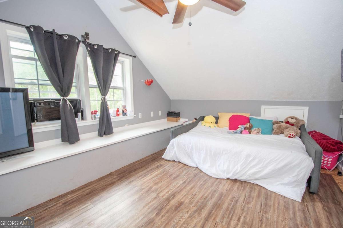 3414 Rock Mills Road LaGrange, GA 30240 - Photo 29 of 54 a bedroom with a bed and a large window