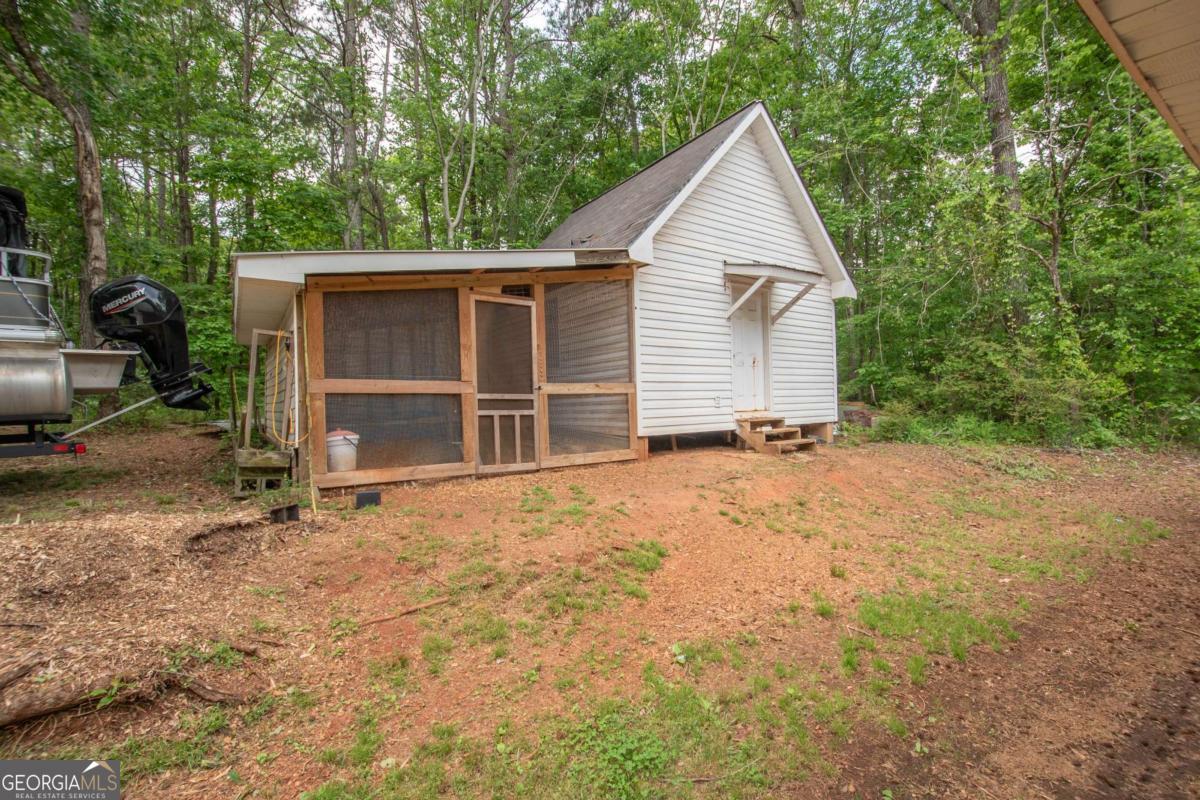 3414 Rock Mills Road LaGrange, GA 30240 - Photo 38 of 54 a view of a house with backyard and garden