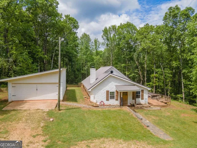 a swimming pool with trees in the background