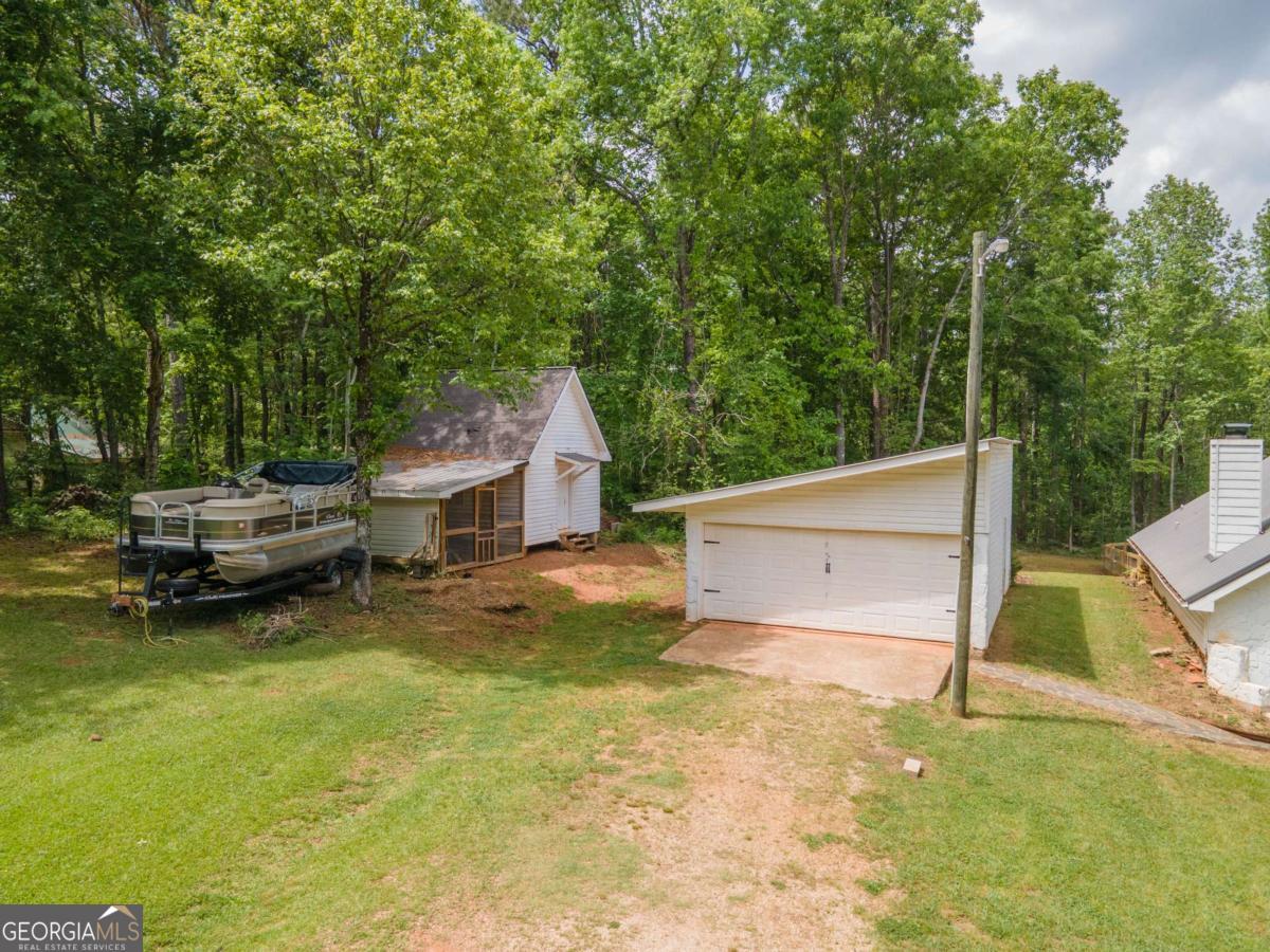 3414 Rock Mills Road LaGrange, GA 30240 - Photo 43 of 54 a view of a house with backyard and sitting area