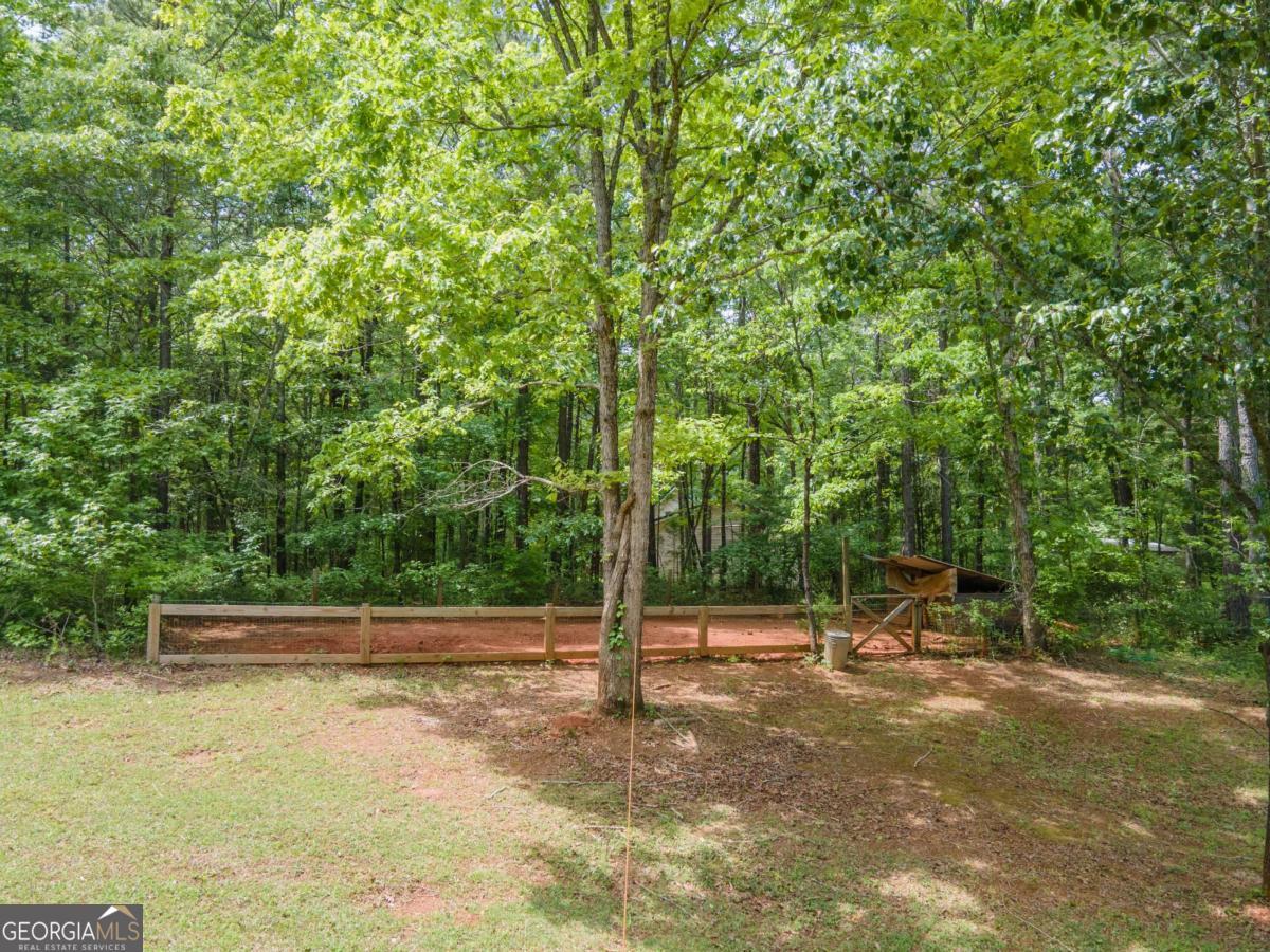 3414 Rock Mills Road LaGrange, GA 30240 - Photo 46 of 54 a view of a bench with lawn chairs
