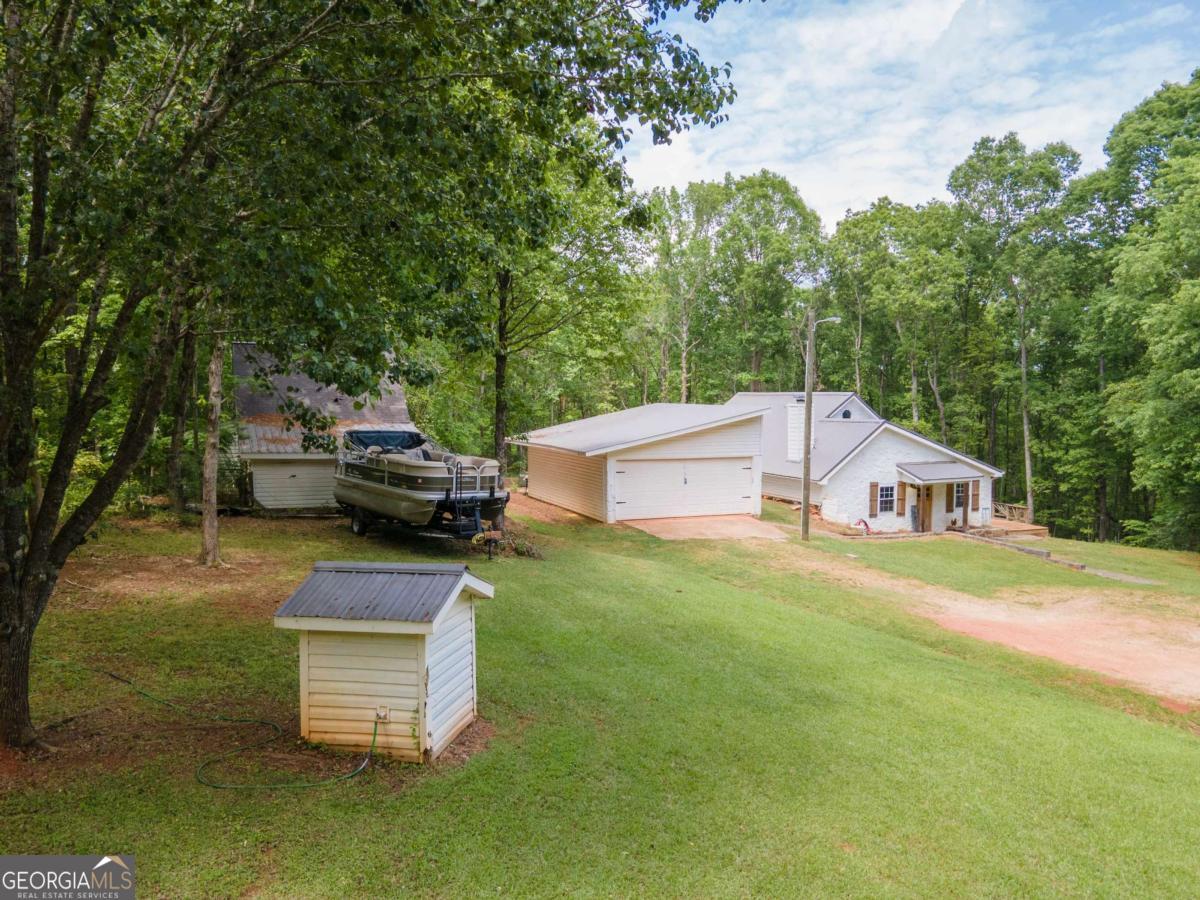 3414 Rock Mills Road LaGrange, GA 30240 - Photo 47 of 54 a aerial view of a house with swimming pool and sitting area