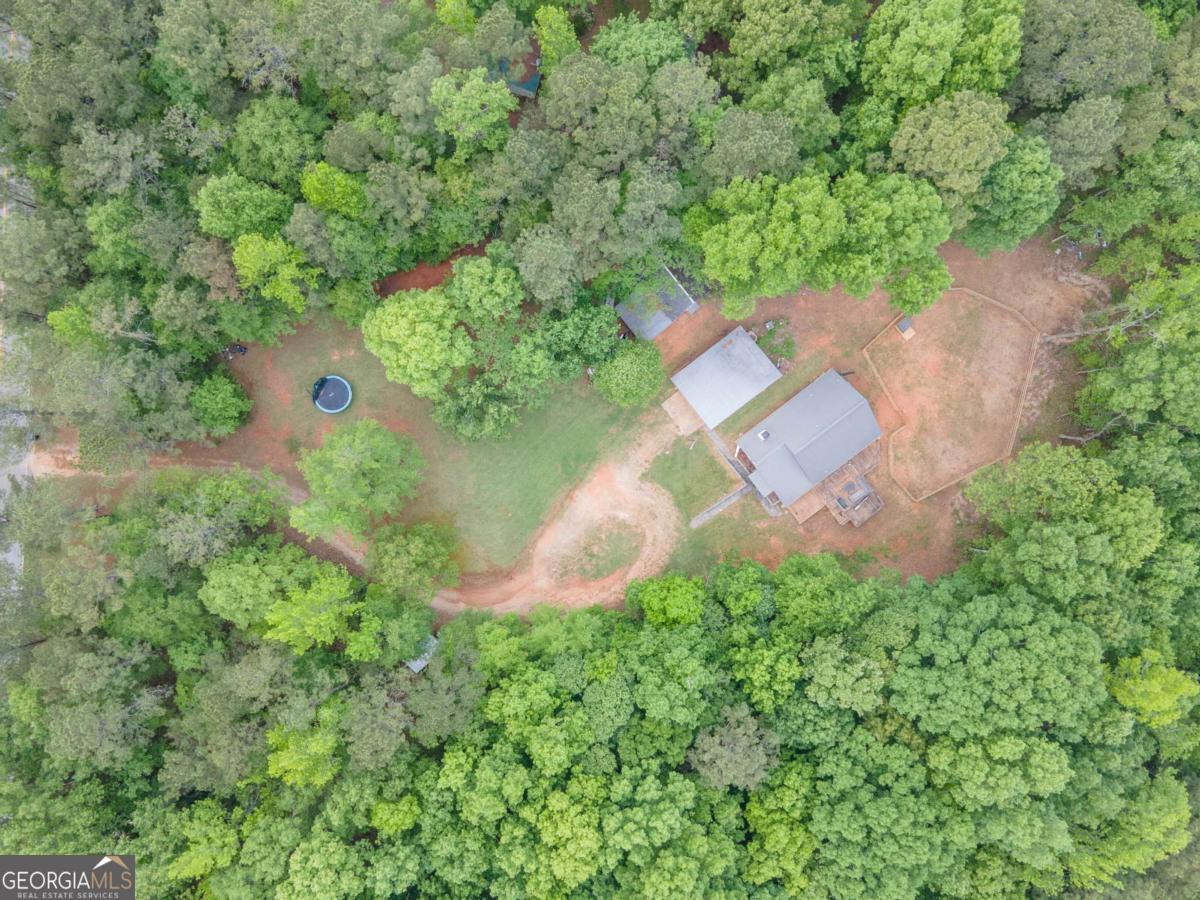 3414 Rock Mills Road LaGrange, GA 30240 - Photo 52 of 54 an aerial view of a house with a yard and a forest