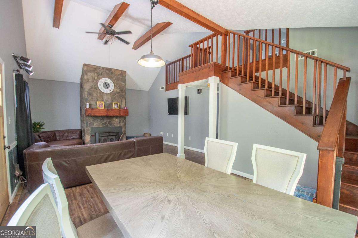 3414 Rock Mills Road LaGrange, GA 30240 - Photo 6 of 54 a view of a livingroom with furniture staircase and a fireplace