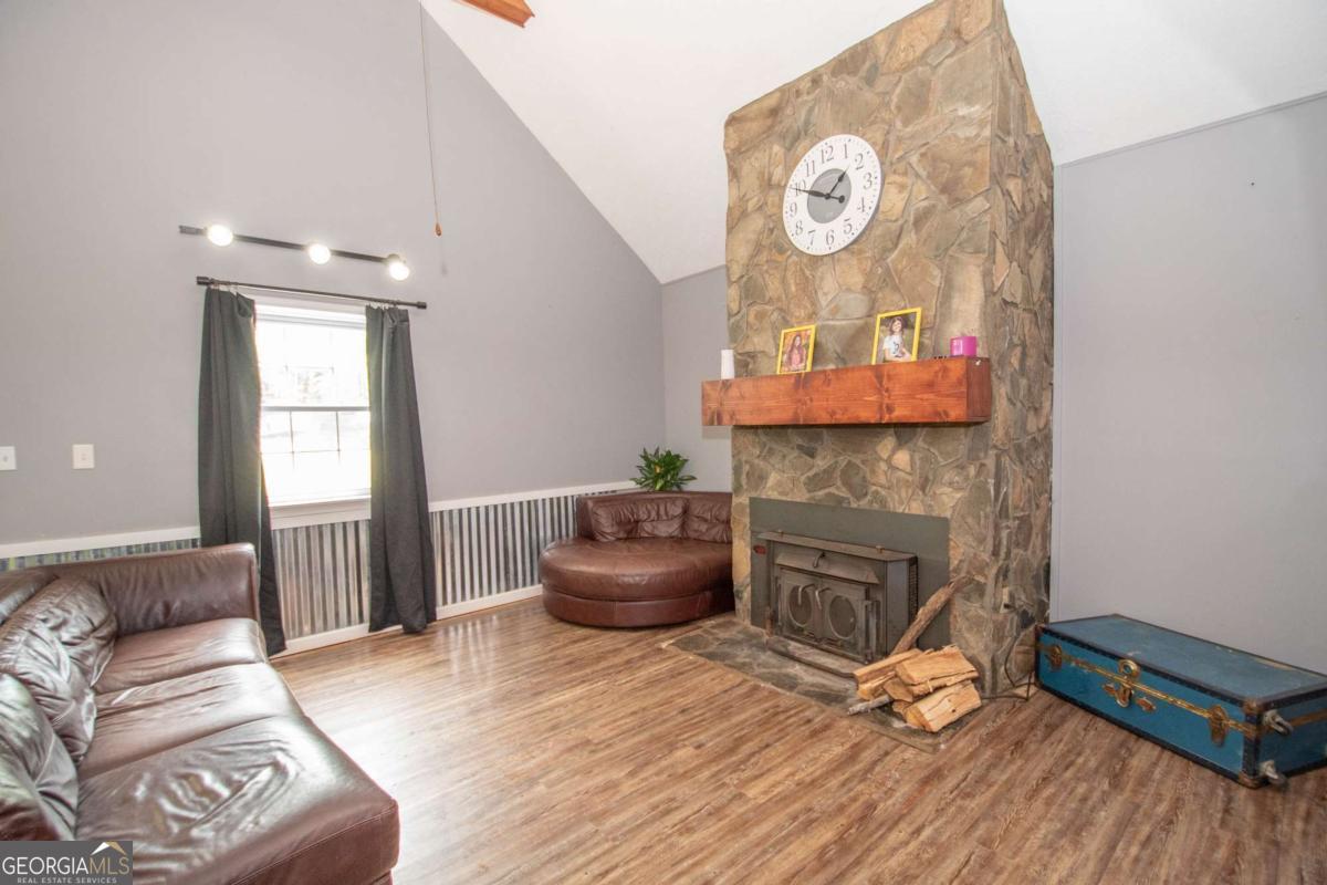 3414 Rock Mills Road LaGrange, GA 30240 - Photo 7 of 54 a living room with furniture and a fireplace