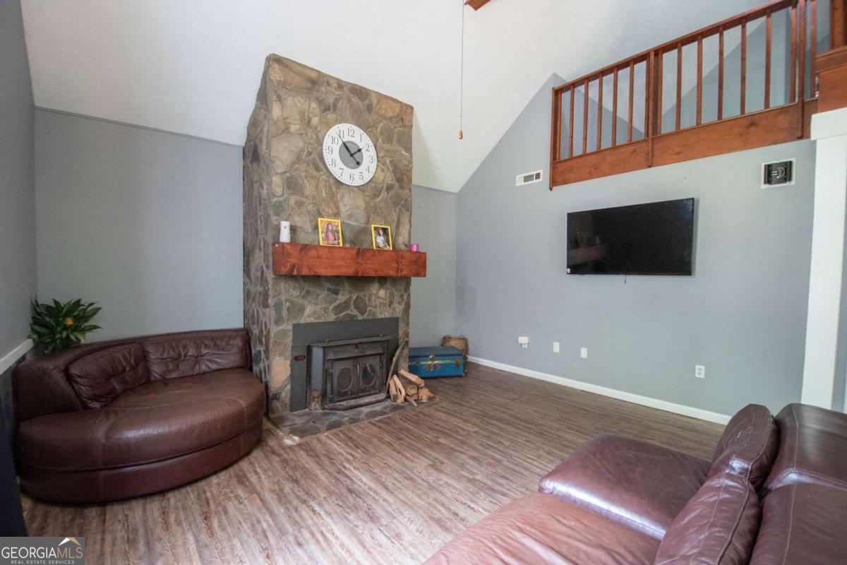 3414 Rock Mills Road LaGrange, GA 30240 - Photo 8 of 54 a living room with furniture and a fireplace