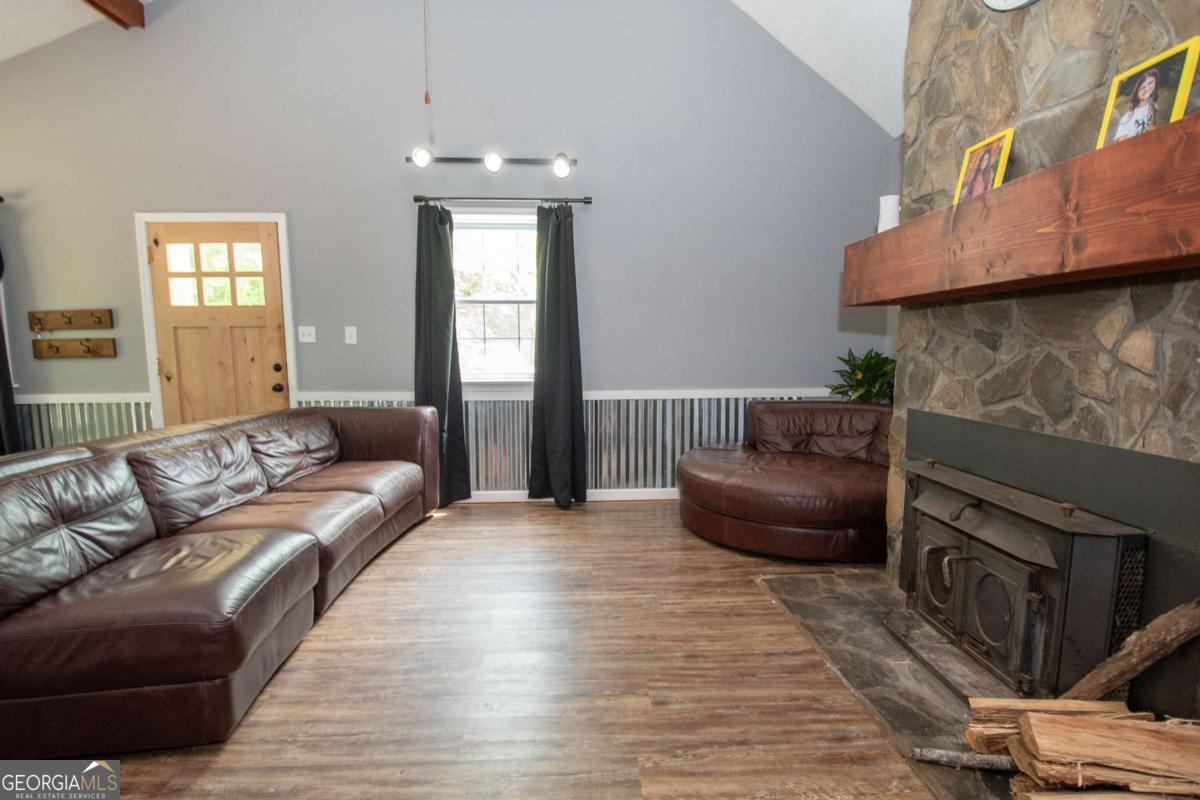 3414 Rock Mills Road LaGrange, GA 30240 - Photo 10 of 54 a living room with furniture and a fireplace