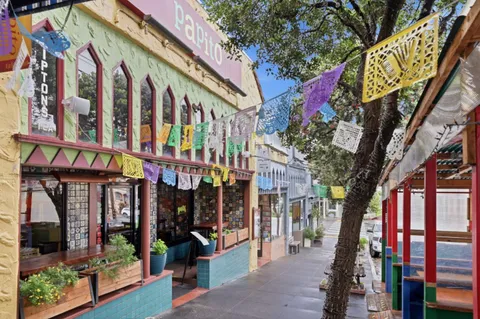 a view of shops on a street