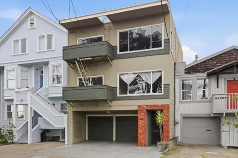 a front view of a house with garage