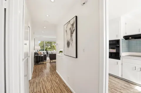a view of a living room with a wooden floor