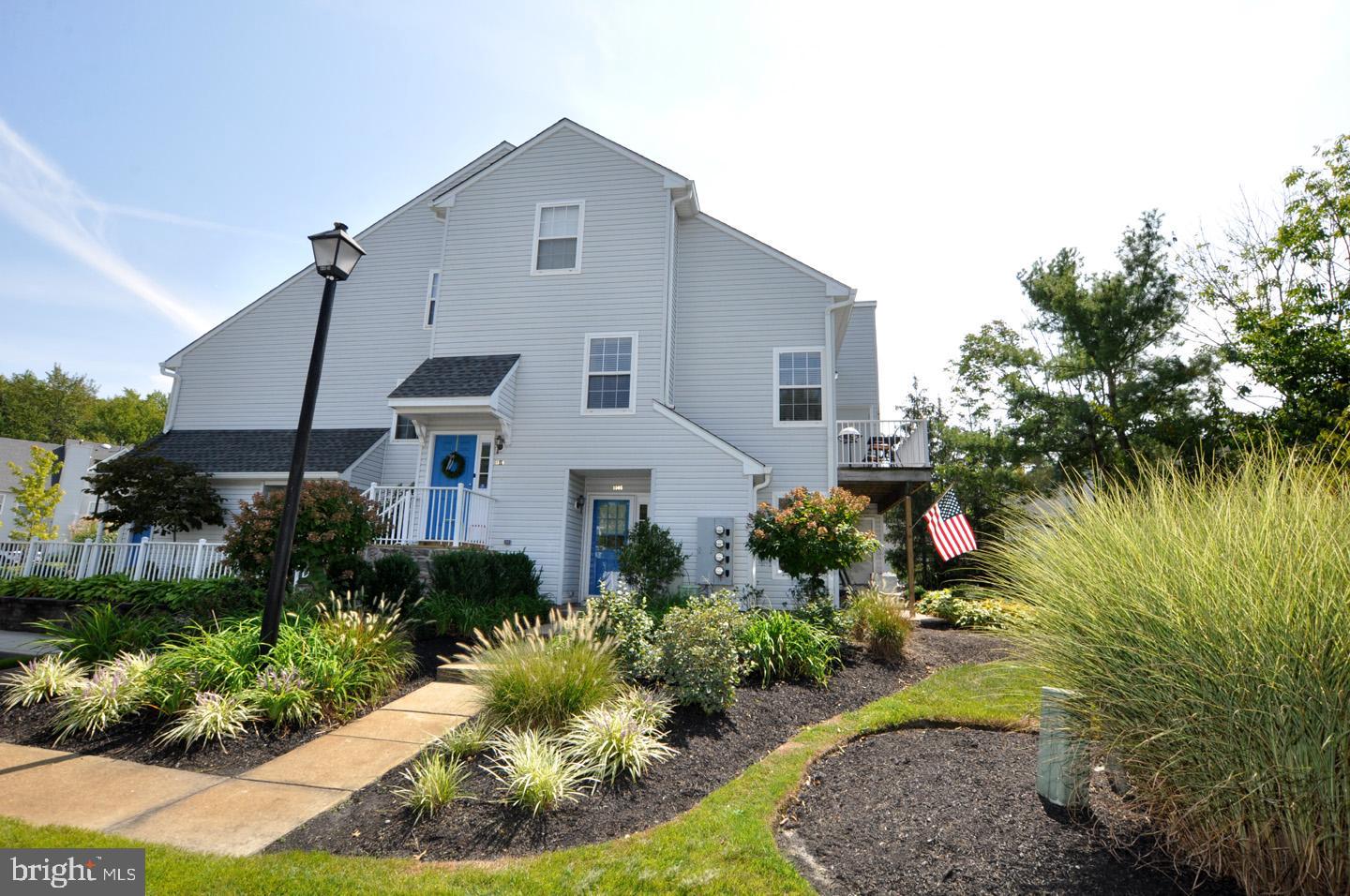1505 Squirrel Road Evesham, NJ 08053 - Photo 1 of 23 a front view of a house with a garden