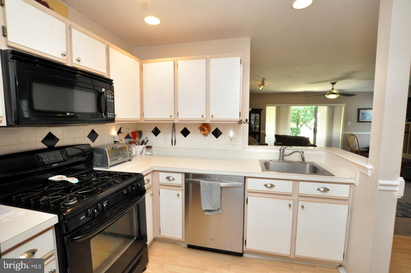 1505 Squirrel Road Evesham, NJ 08053 - Photo 11 of 23 a kitchen with a sink stove and microwave