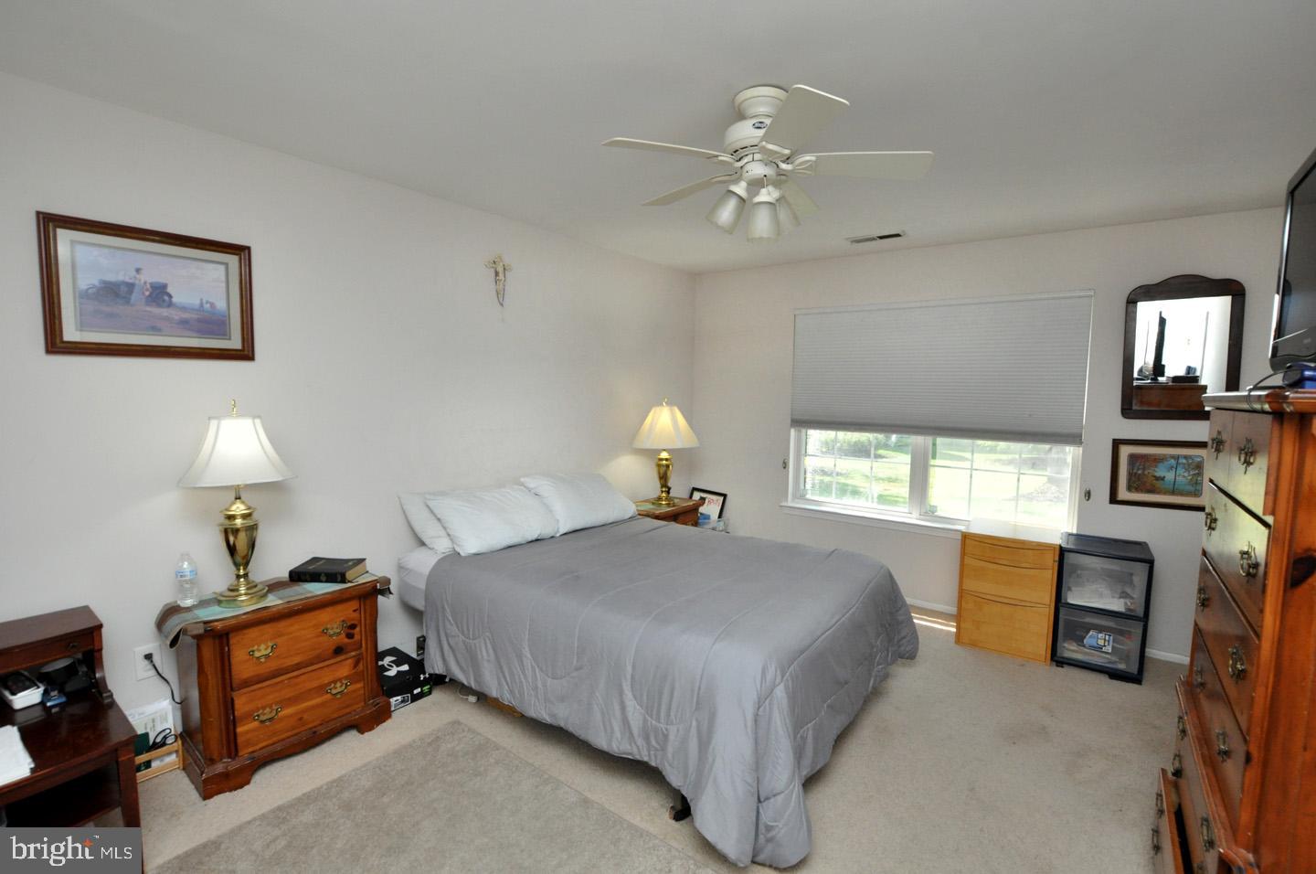 1505 Squirrel Road Evesham, NJ 08053 - Photo 17 of 23 a bedroom with a bed and wooden floor